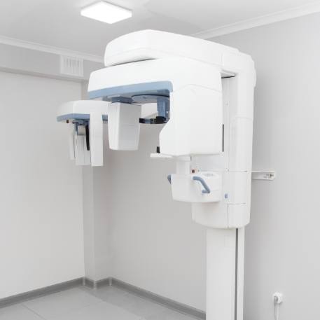 C T cone beam scanner against white wall of Califon dental office