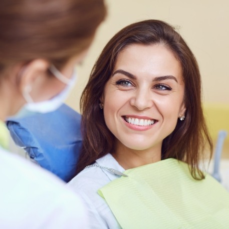 Woman smiling during preventive dentistry checkup in Califon